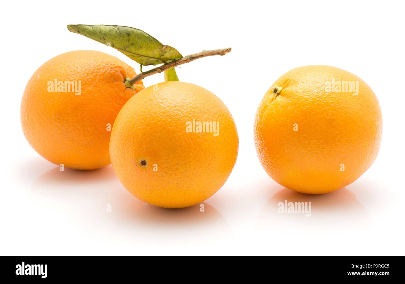 Oranges with green leaf isolated on white background three whole Stock Photo