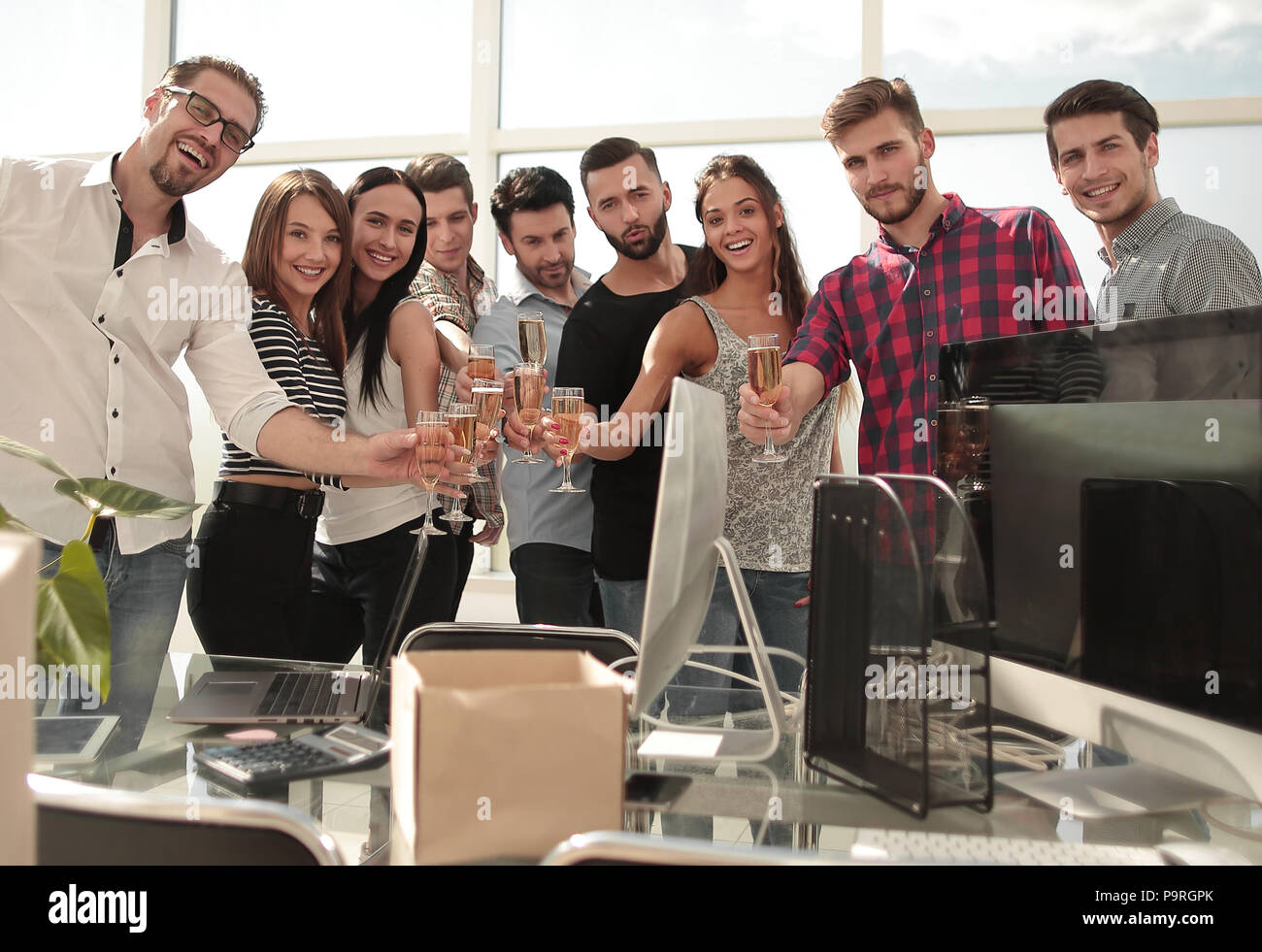 smiling business team standing in new office Stock Photo - Alamy