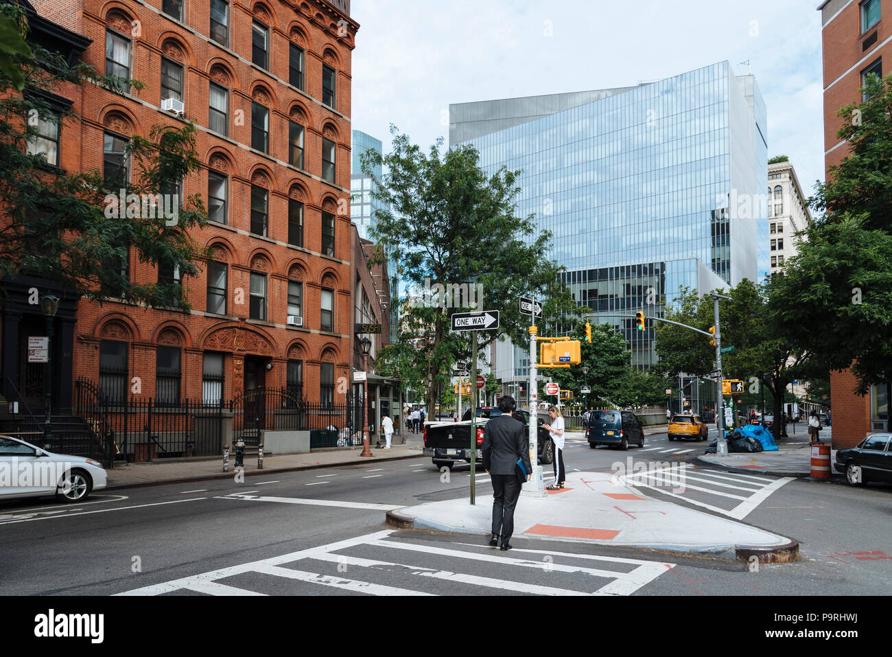 New York City, USA June 20, 2018 Rear view of man crossing Stuyvesant Street in East Village