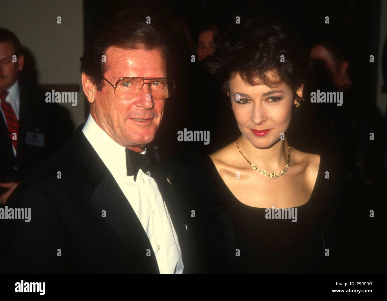 BEVERLY HILLS, CA - MARCH 22: (L-R) Actor Roger Moore and daughter Deborah Moore attend the 44th Annual Writers Guild of America Awards on March 22, 1992 at the Beverly Hilton Hotel in Beverly Hills, California. Photo by Barry King/Alamy Stock Photo Stock Photo