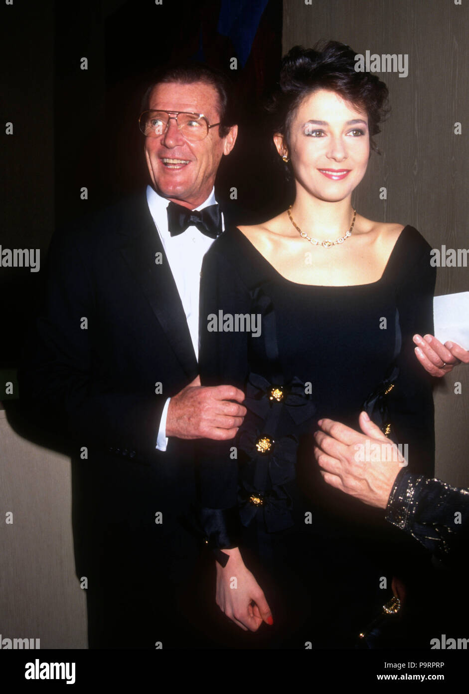 BEVERLY HILLS, CA - MARCH 22: (L-R) Actor Roger Moore and daughter Deborah Moore attend the 44th Annual Writers Guild of America Awards on March 22, 1992 at the Beverly Hilton Hotel in Beverly Hills, California. Photo by Barry King/Alamy Stock Photo Stock Photo