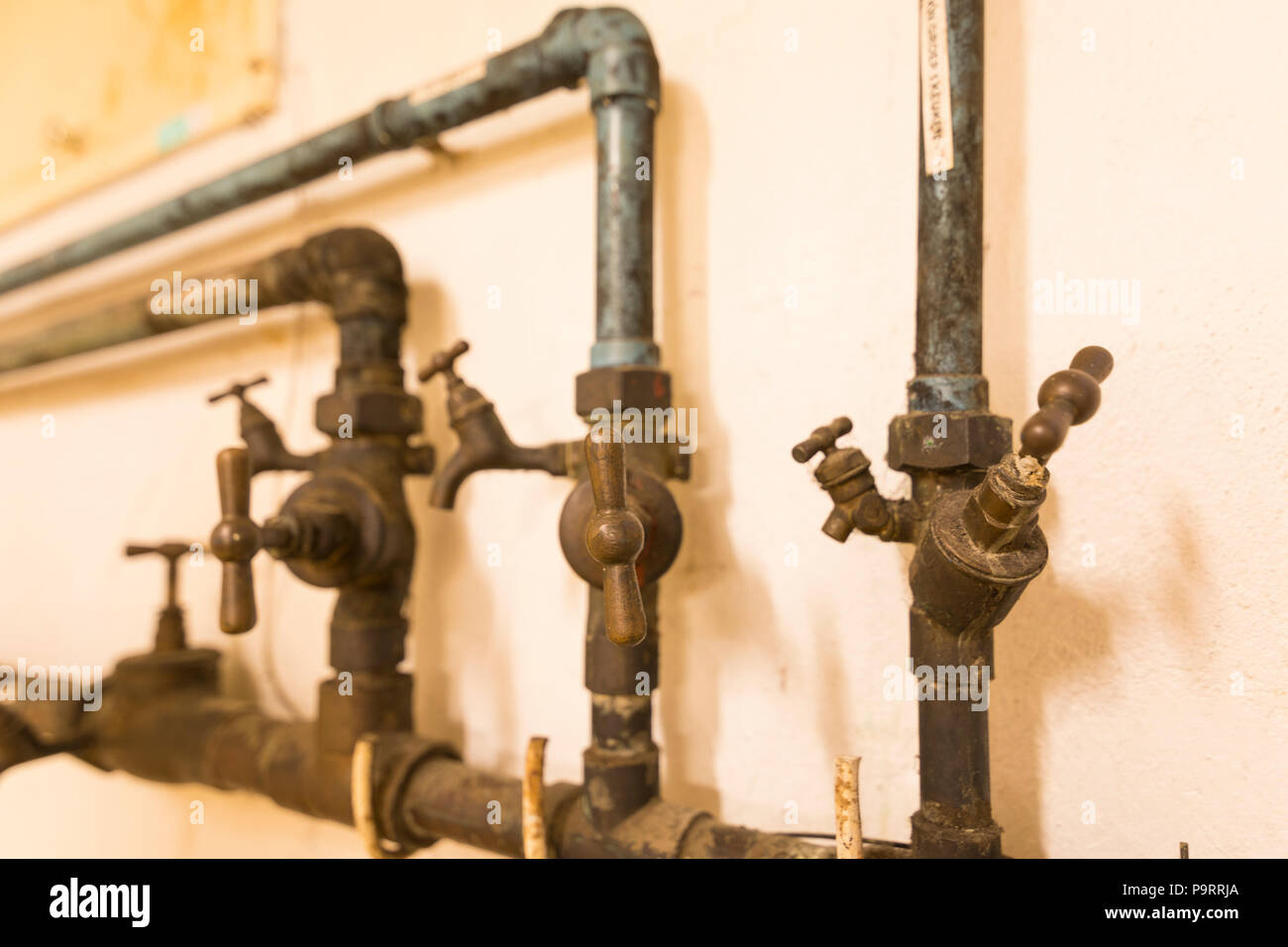Water pipes and taps belonging to old building Stock Photo Alamy