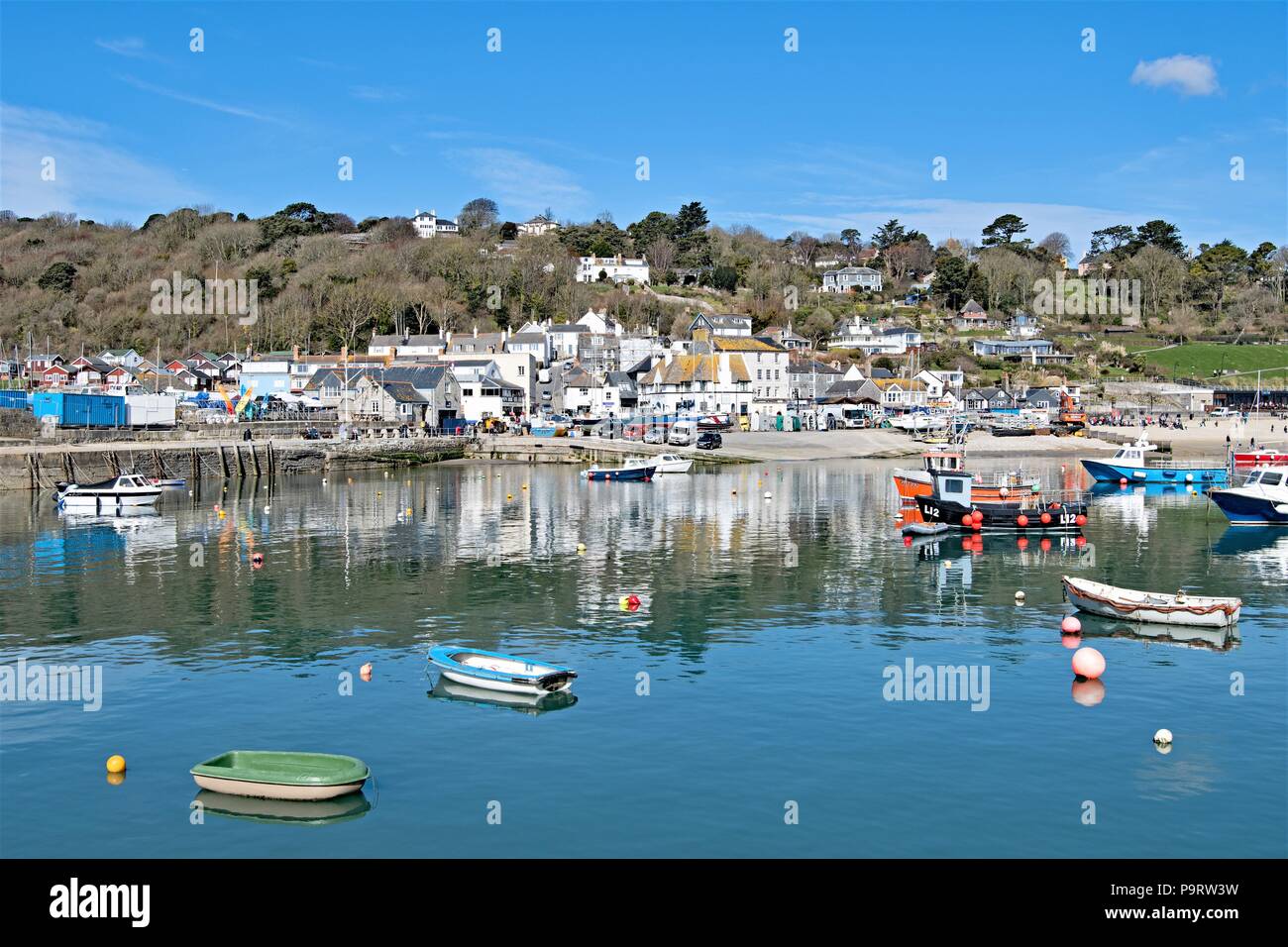Taken to capture horizontal reflections in the harbour on a glorious spring day. Stock Photo