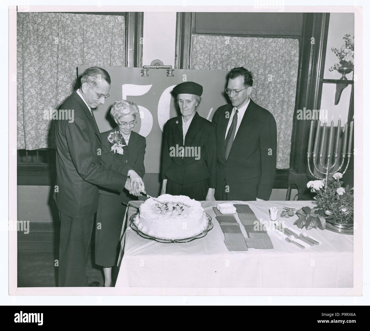 302 Chatham Square 50th Anniversary, 2nd Carnegie Branch Building- Ralph Allen Beals, Director; Marion E. Lang; Mrs. Alison B. Alessios; John Mackenzie Cory, Chief of Circulation (NYPL b11524053-1150624) Stock Photo