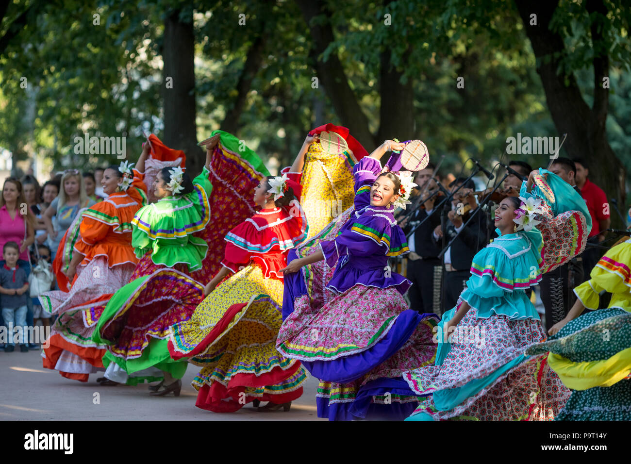 KAZANLAK, BULGARIA - JULY 21, 2016: Beautiful Mexican dancers in traditional costumes from Mexico amazingly perform a spectacular fast dance at a free Stock Photo