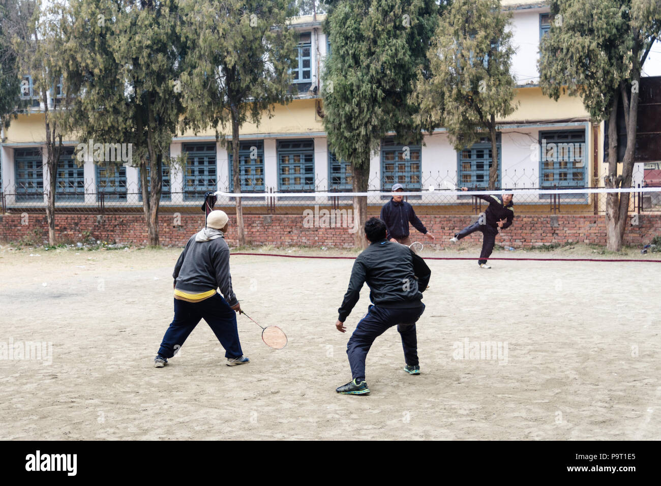 Local men playing badminton in Bhaktapur, Nepal Stock Photo