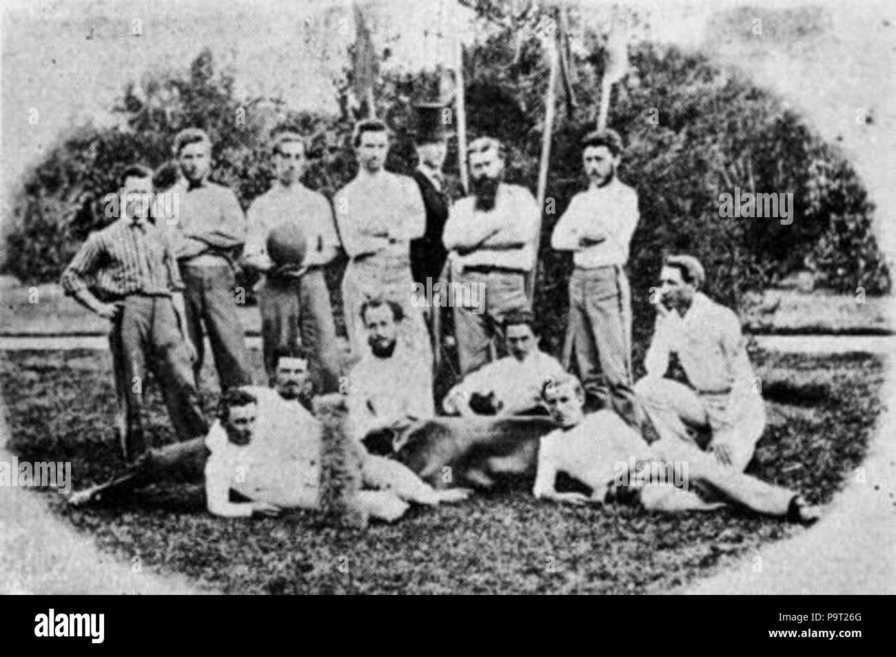 . English: The association football squad of Brisbane, Australia. This image, from the John Oxley Library at the State Library of Queensland, if correctly dated, is more likely a photograph of a Brisbane 'Melbourne rules' team and possibly the Rangers FC, rather than Brisbane FC, which played in scarlet, as noted above (note also that Melbourne rules was played with a near-spherical ball at that time). Alternatively, given the number of players in the photograph, it may be an association football team from a later date. circa 1870 248 Brisbane soccer team c1870 Stock Photo