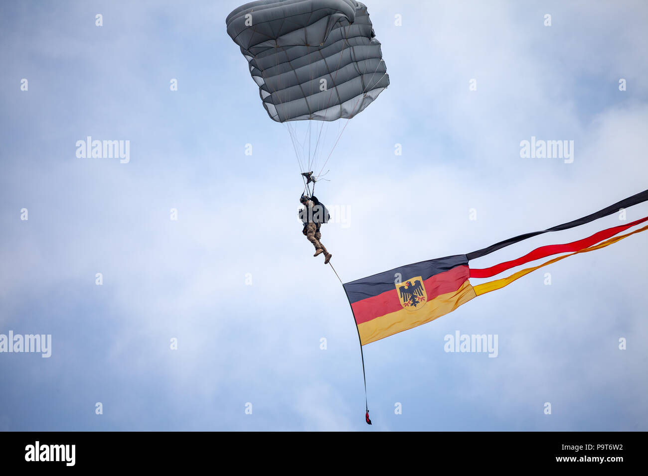 FELDKIRCHEN / GERMANY - JUNE 9, 2018: Paratrooper from Bundeswehr, german army lands on an open day on day of the Bundeswehr in Feldkirchen Stock Photo