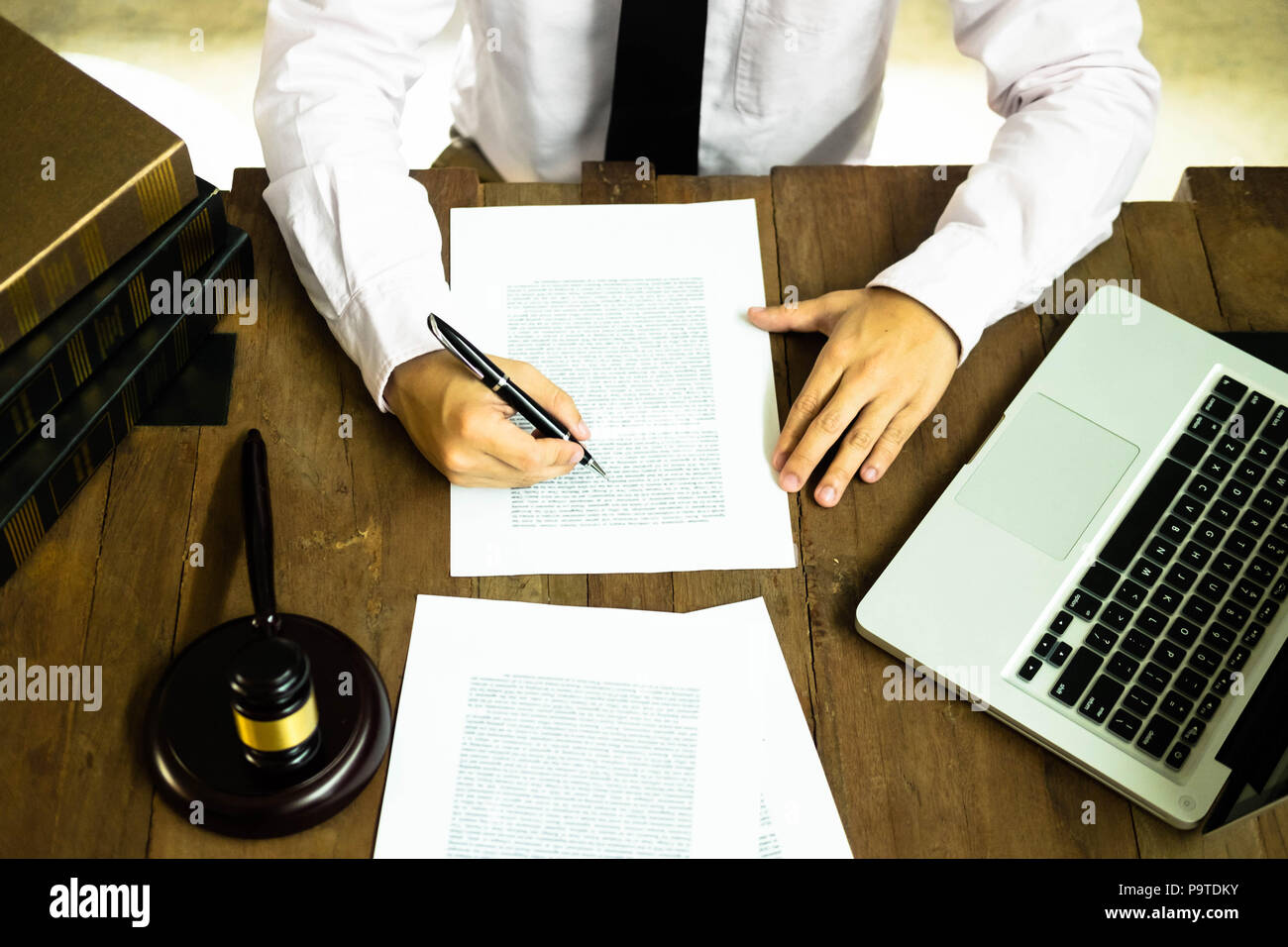 Lawyer working with contract papers on the table in office. consultant lawyer, attorney, court judge, concept. Stock Photo