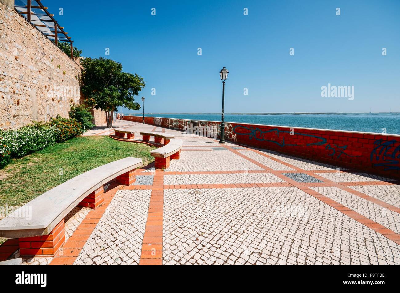 Cobblestone path along the historic city walls of Faro, Algarve, Portugal Stock Photo