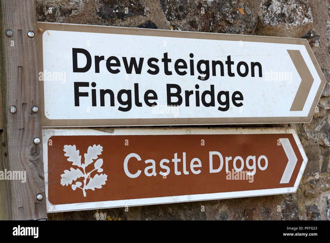 Place names on a roadside sign giving directions to Drewsteignton ...