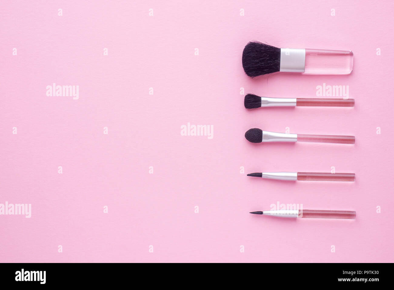 Make-up brushes on a pastel pink background. Beauty concept Stock Photo