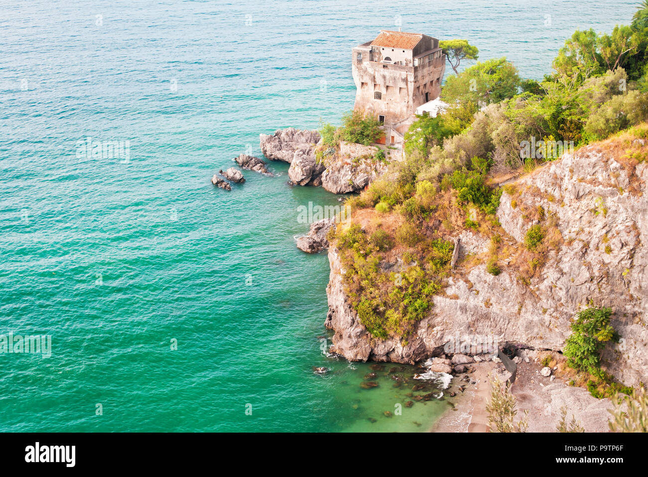 view of old medieval fort tower on rocks by Mediterranean sea near Vietri Sul Mare, Salerno, Amalfi coast, Campania province, taly Stock Photo