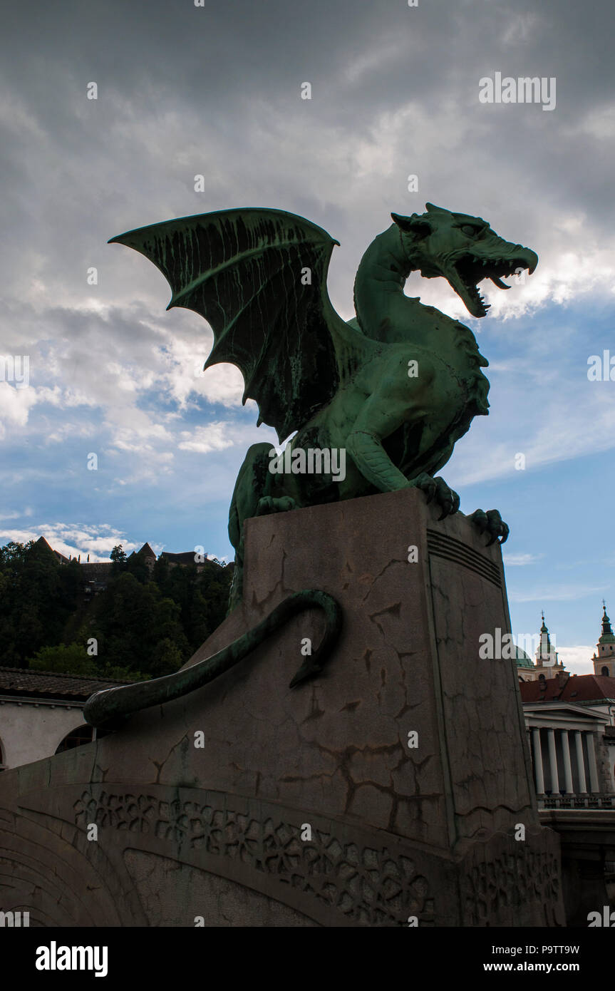 Dragon statue by Jurij Zaninović on the Dragon Bridge (Zmajski most), the most famous road bridge of Ljubljana built in the early 20th century Stock Photo