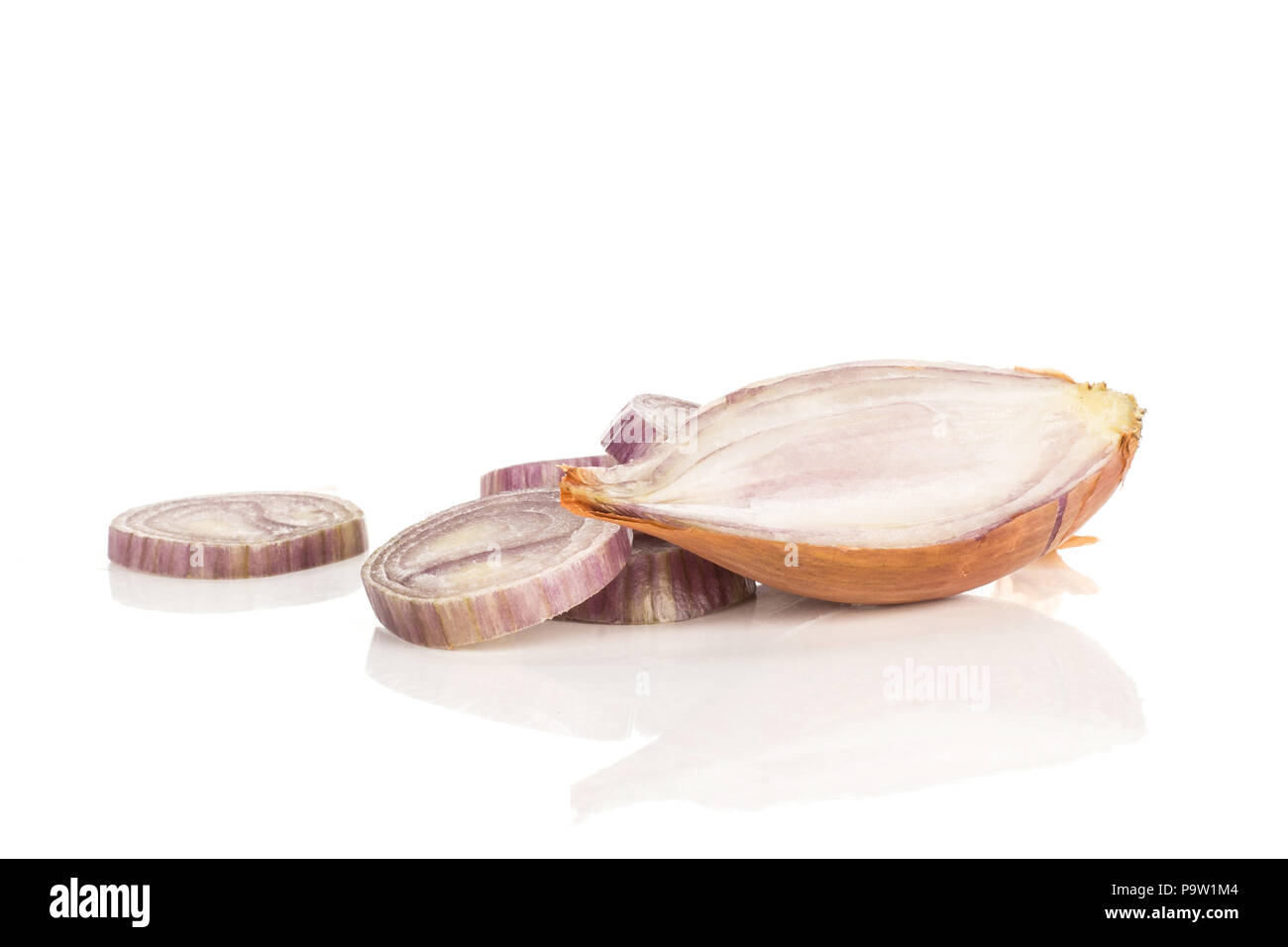 One shallot half and sliced rings isolated on white background Stock