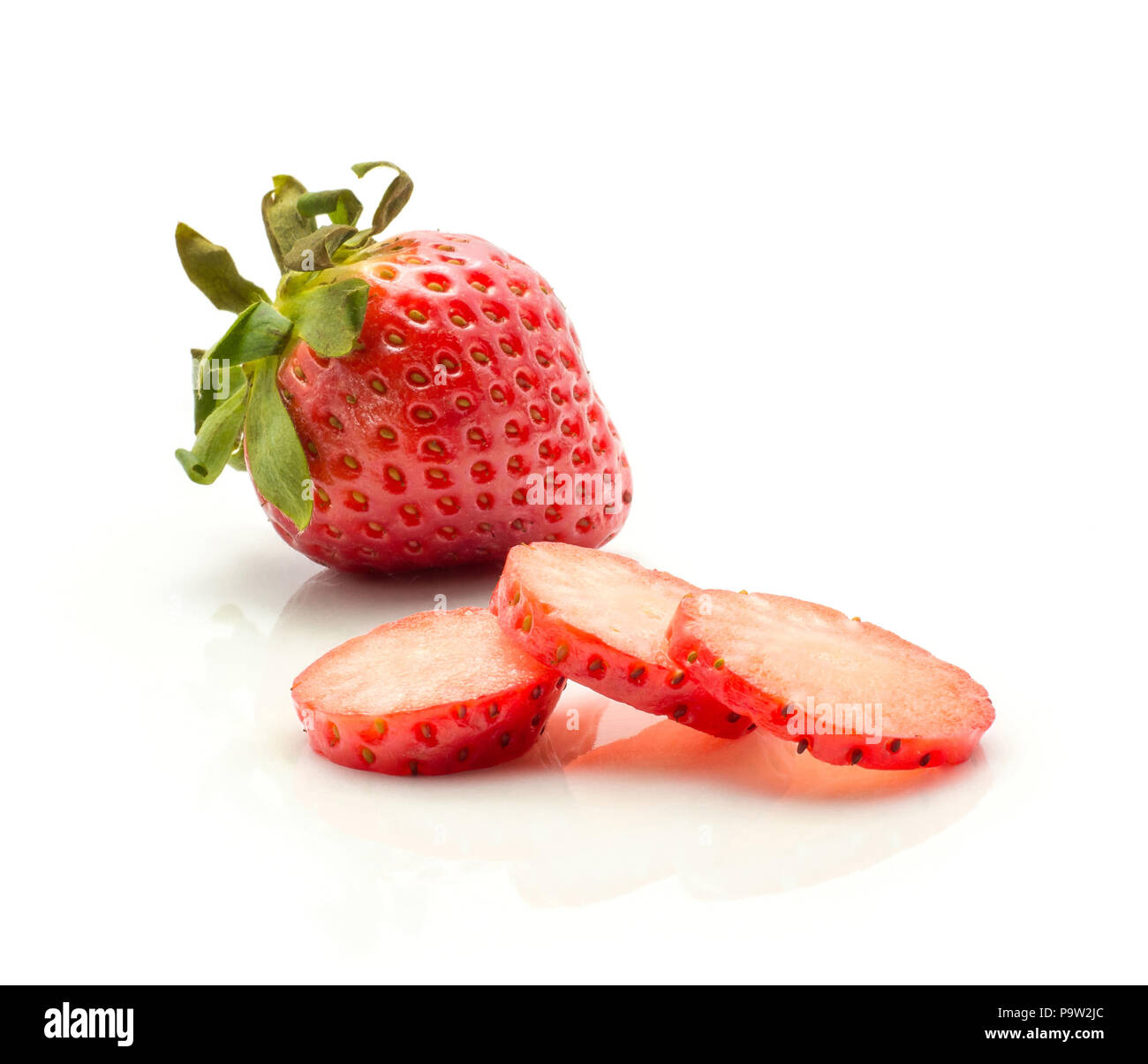 One garden strawberry three round slices isolated on white background Stock Photo