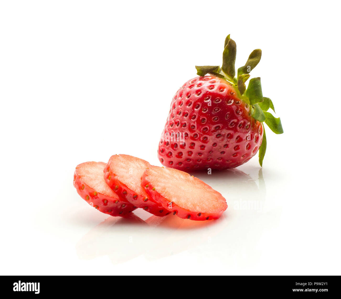 One garden strawberry and three round slices isolated on white background Stock Photo