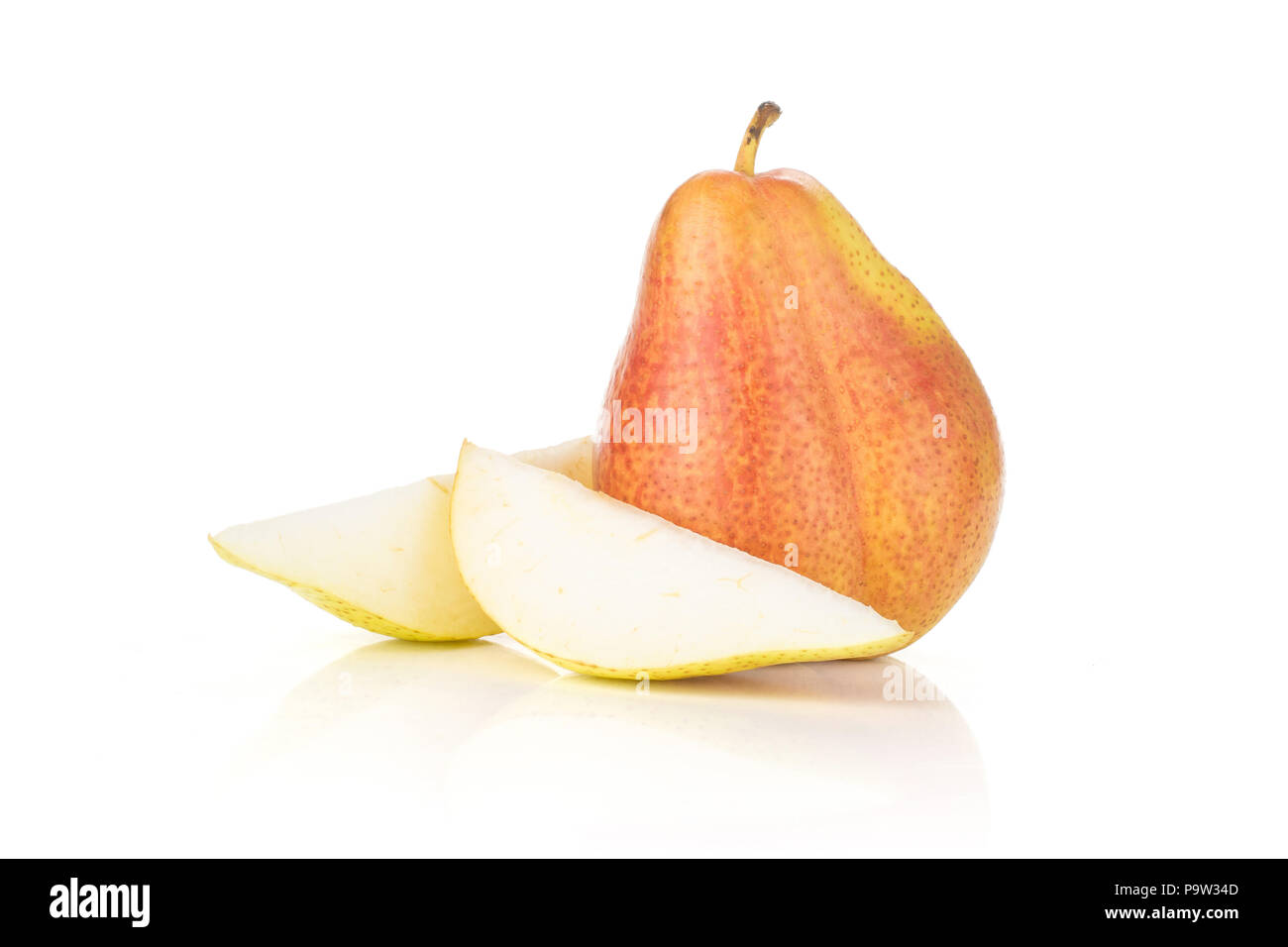 Group of one whole two slices of fresh red pear forelle variety isolated on white Stock Photo