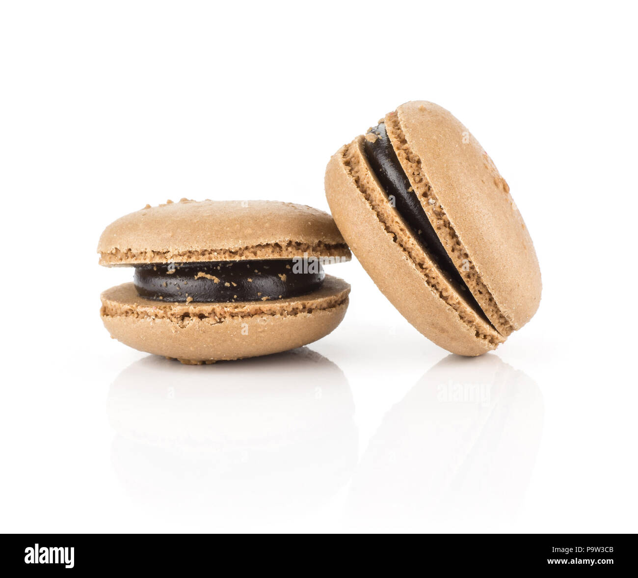 Two chocolate French macarons isolated on white background Stock Photo