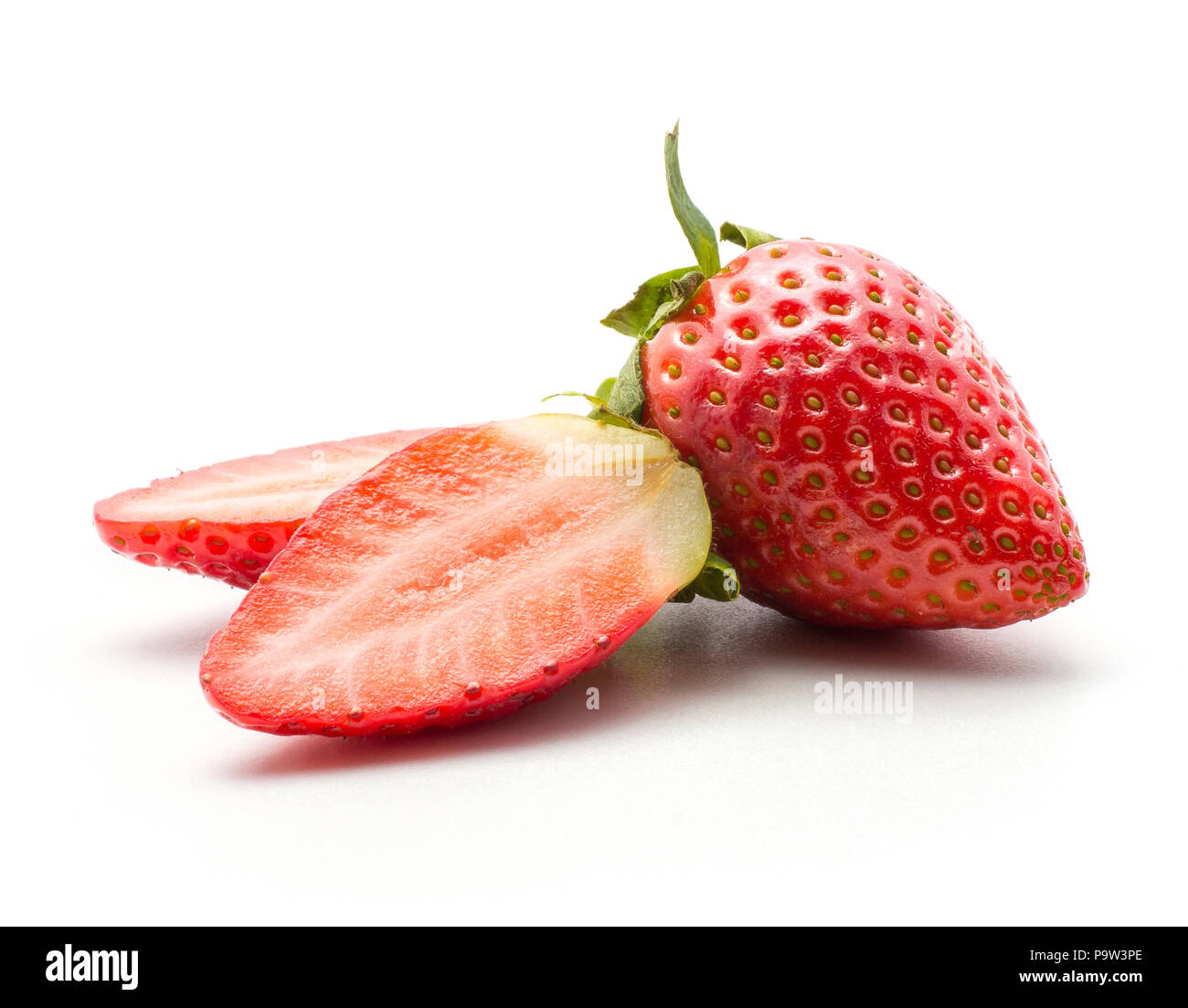 Ripe garden strawberry and two fresh cut halves isolated on white background Stock Photo