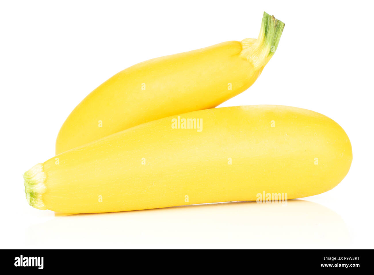 Group of two whole raw yellow zucchini isolated on white Stock Photo