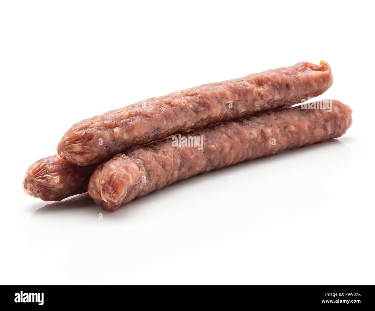 Three Hungarian dry sausages pepperoni isolated on white background