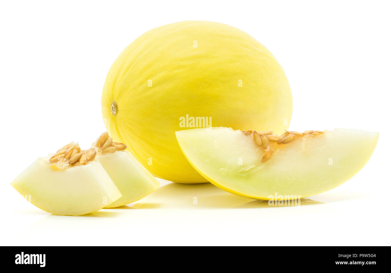 One yellow honeydew melon with one slice and two pieces isolated on white background Stock Photo