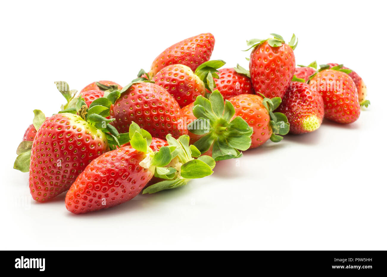 Fresh strawberries heap isolated on white background Stock Photo
