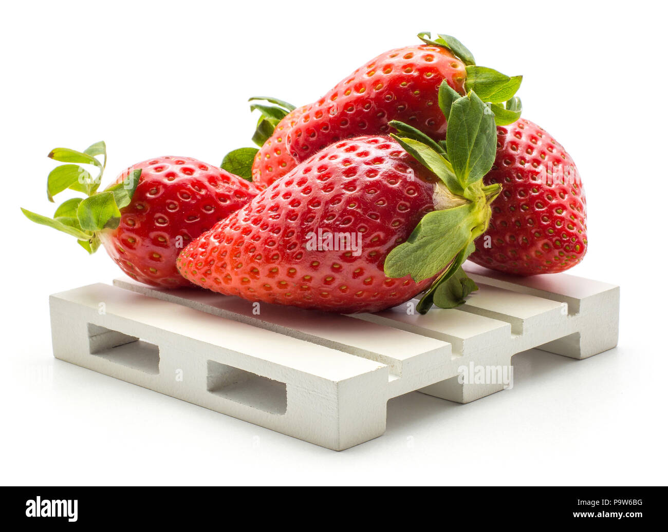 Fresh garden strawberries on a pallet isolated on white background Stock Photo