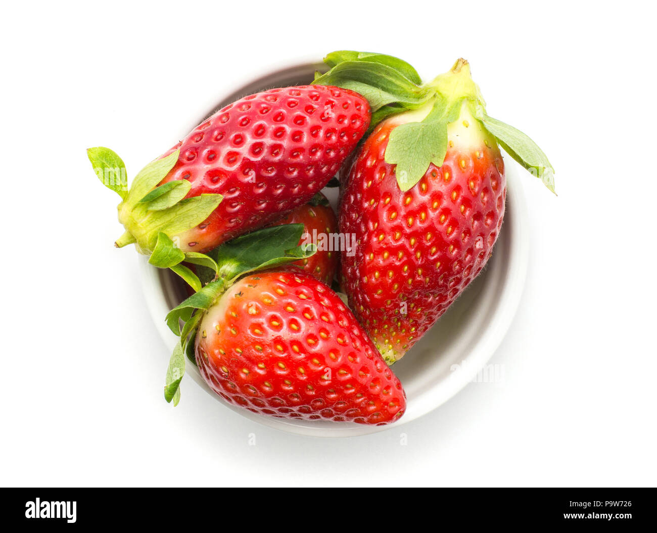 Garden strawberries in a ceramic top view isolated on white background ideal breakfast Stock Photo