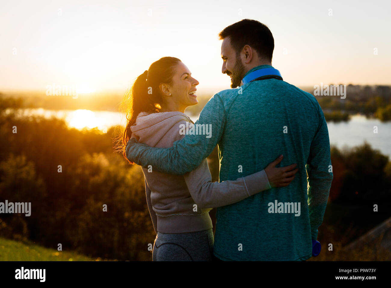 Happy young sporty couple sharing romantic moments Stock Photo - Alamy