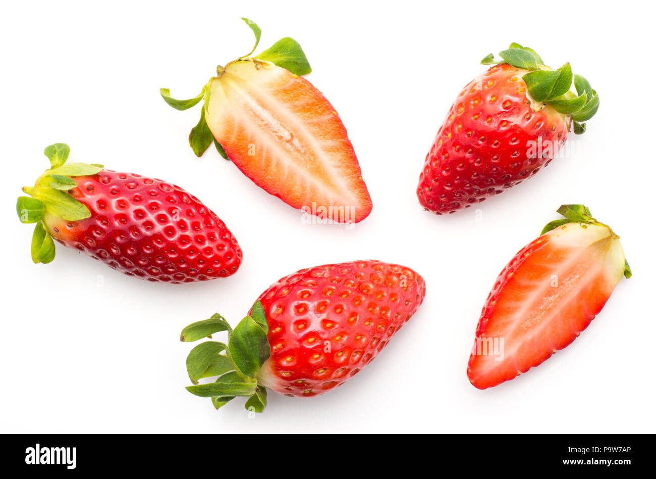 Fresh garden strawberries pattern isolated on white background three whole and two fresh cut halves Stock Photo