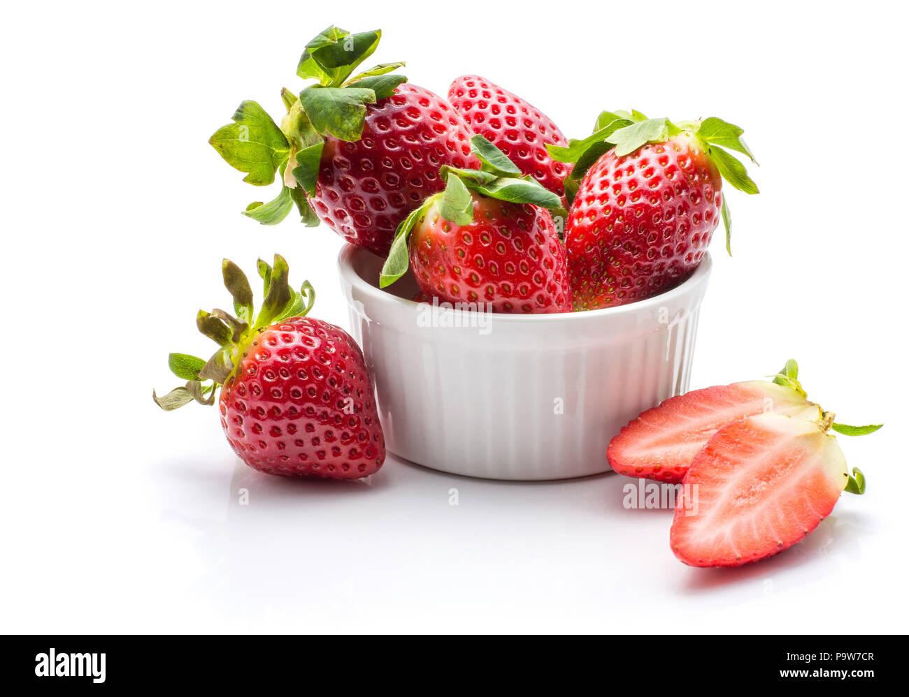 Garden strawberries in a ceramic isolated on white background ideal breakfast Stock Photo