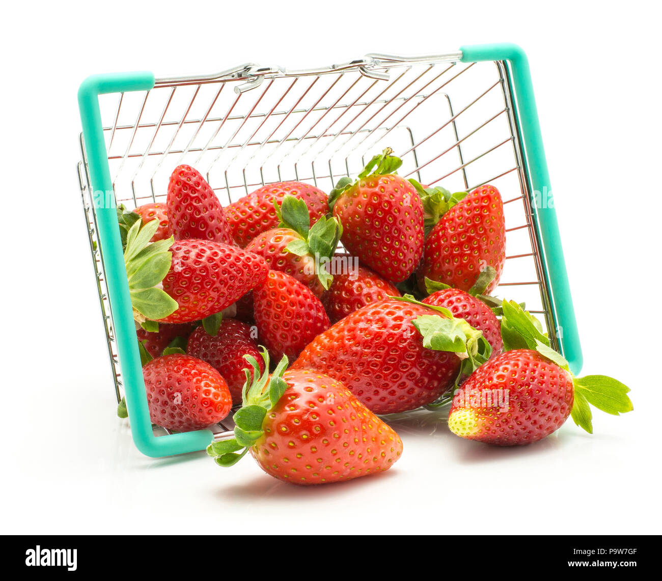 Garden strawberries out a shopping basket isolated on white background Stock Photo