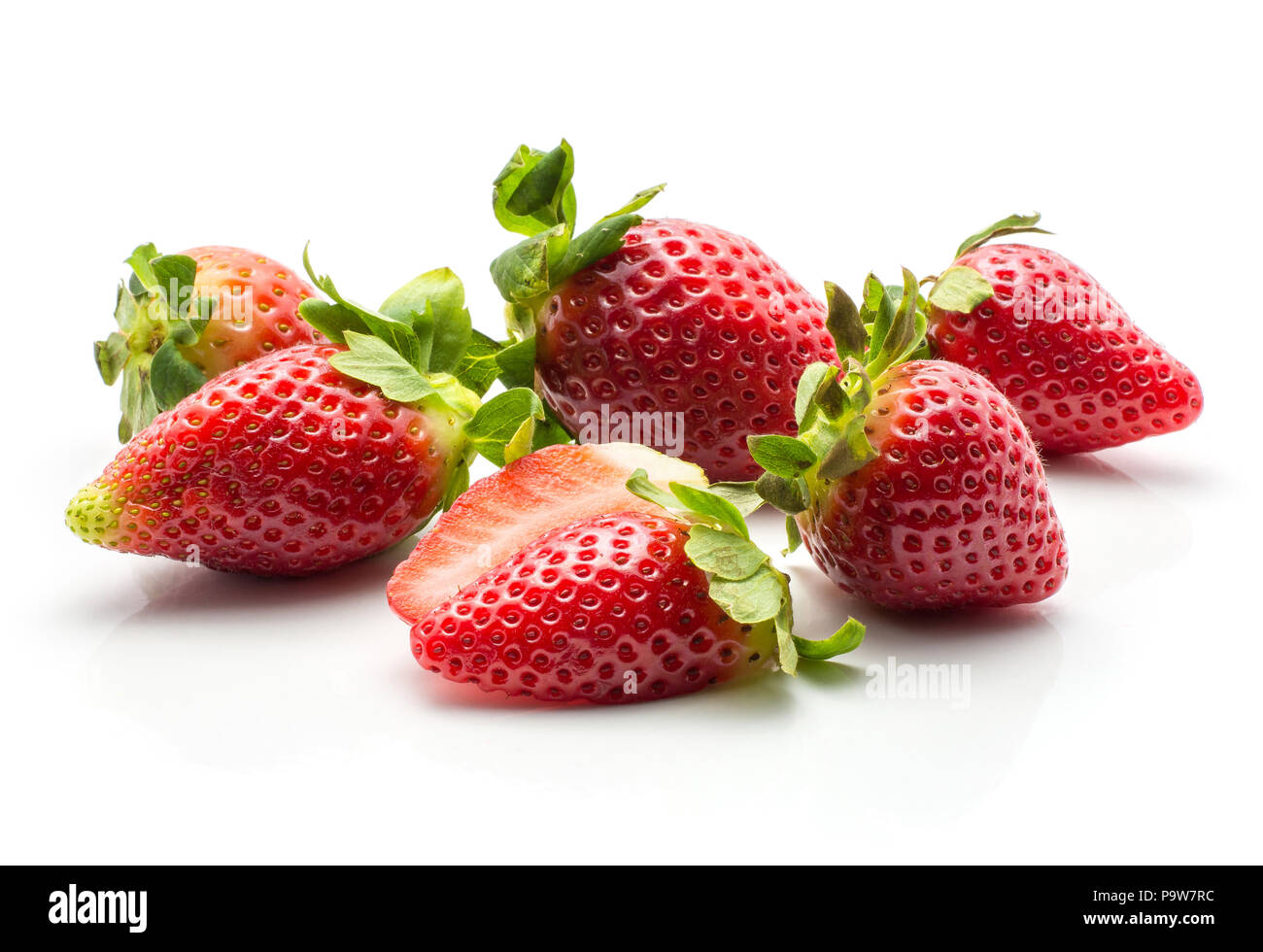 Garden strawberries set and one sliced isolated on white background fresh ripe Stock Photo