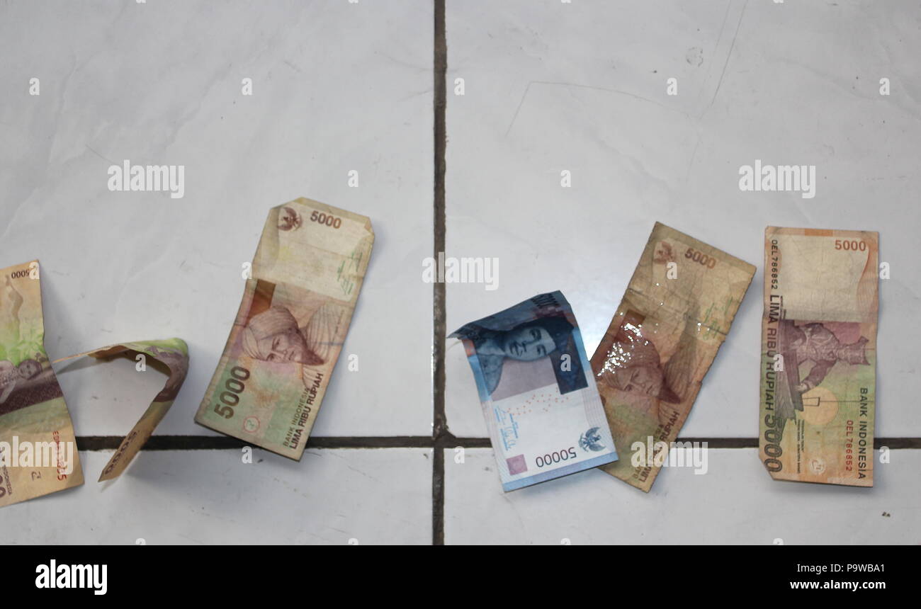 Finding money on floor Stock Photo