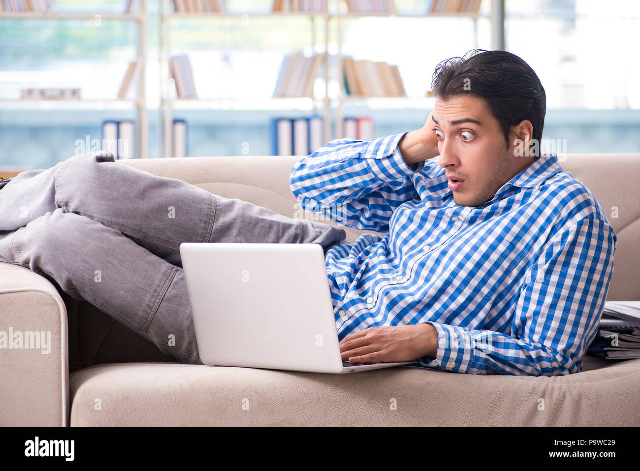 Caucasian student with laptop preparing for university exams Stock ...