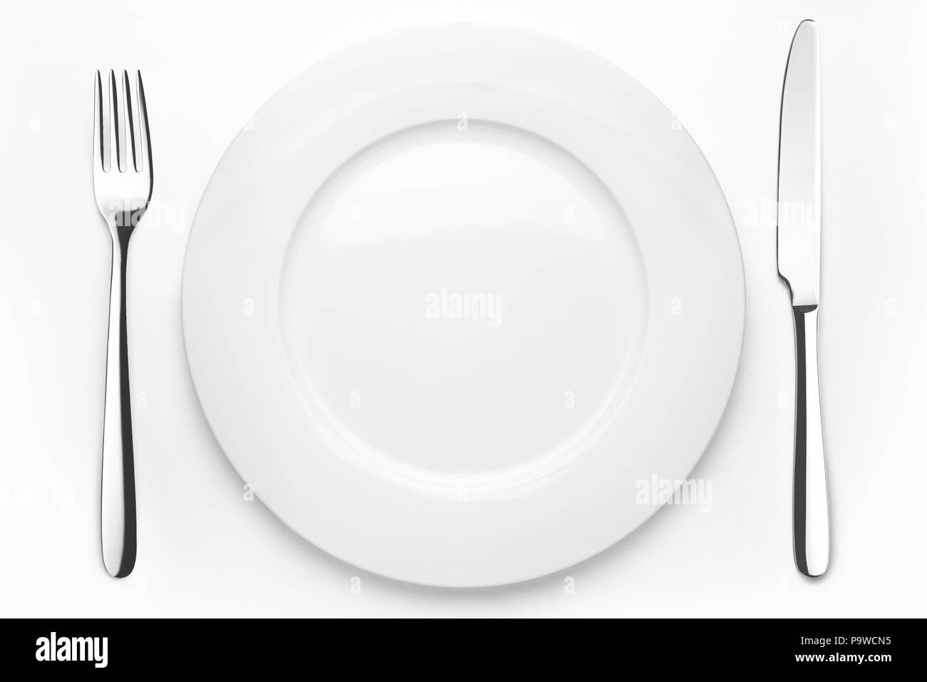 Empty plate, fork, knife, clipping path, white background, isola Stock Photo