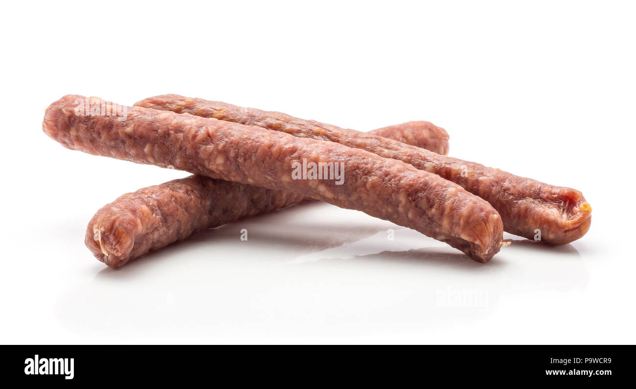 Hungarian dry sausages pepperoni isolated on white background group of three smoked in natural