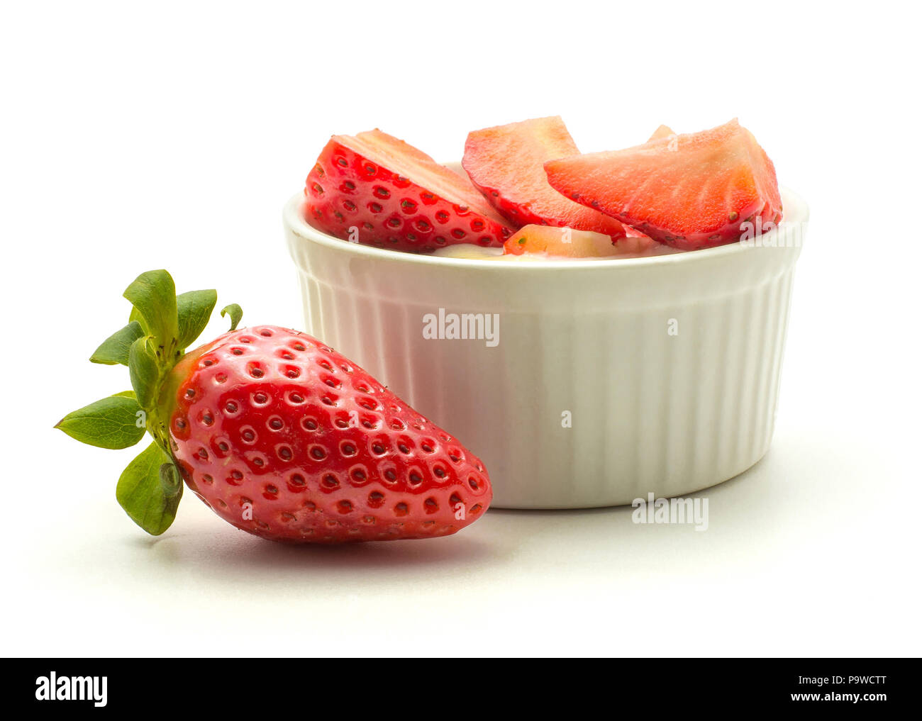 Garden strawberries in a cream isolated on white background ideal breakfast Stock Photo