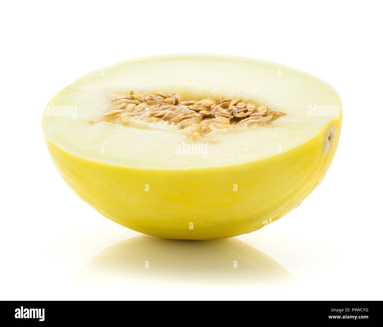 One yellow honeydew melon half with seeds isolated on white background Stock Photo