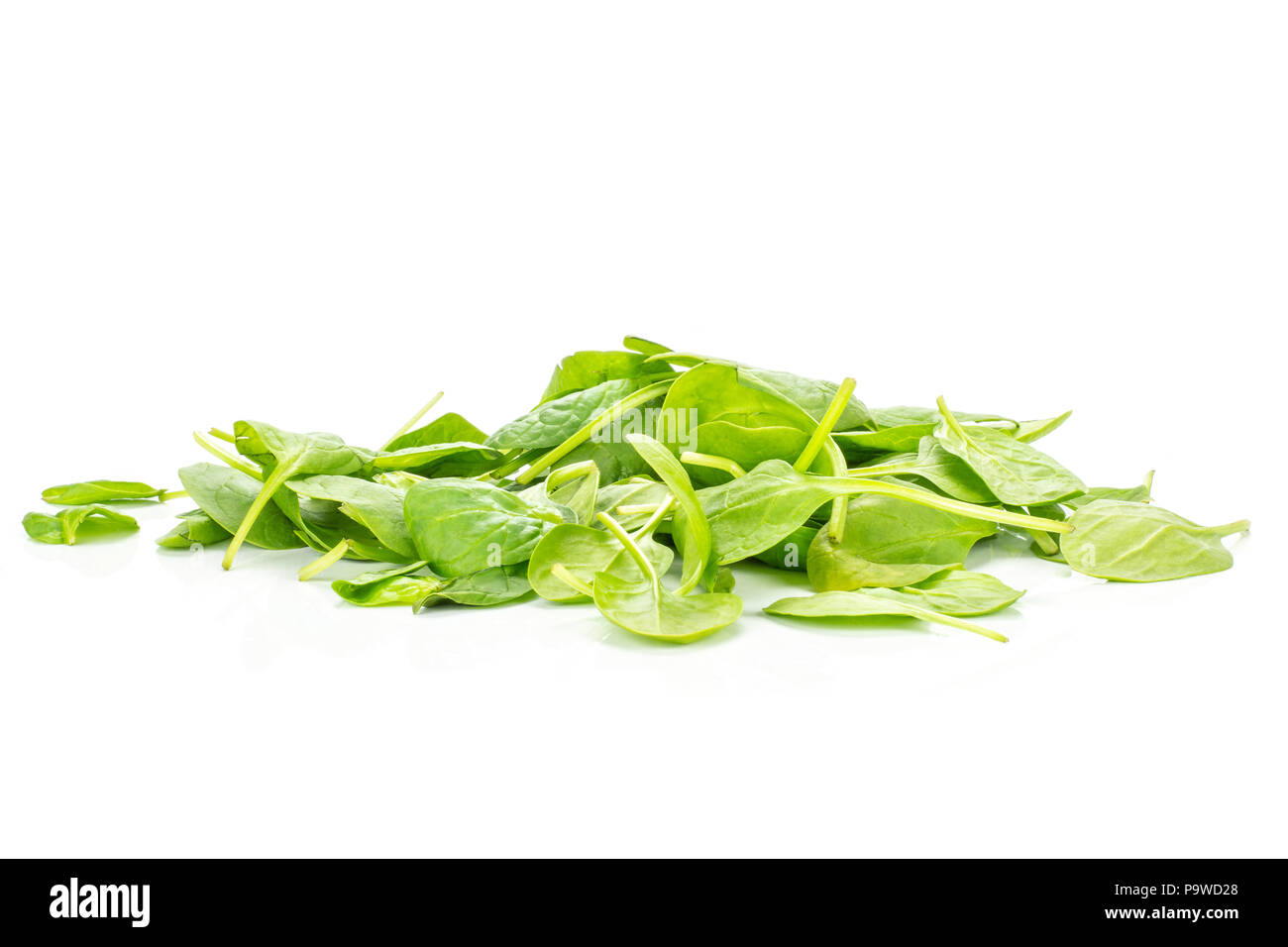 Fresh baby spinach heap isolated on white background Stock Photo
