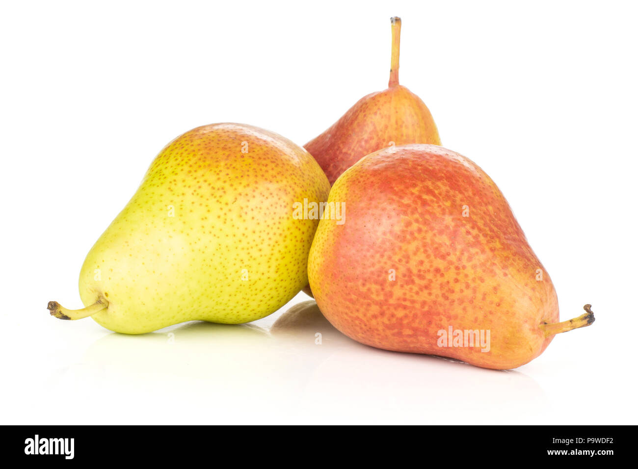 Group of three whole fresh red pear forelle variety stack isolated on white Stock Photo