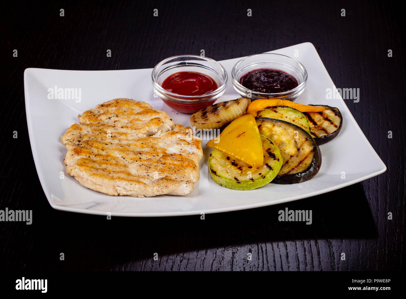 Tasty grilled chicken stake and vegetables Stock Photo Alamy
