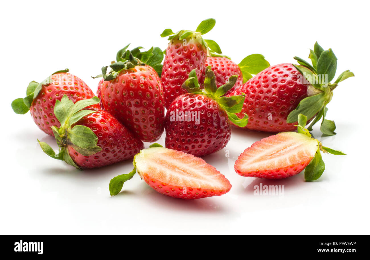 Garden strawberries stack isolated on white background ripe whole and one cut in half Stock Photo
