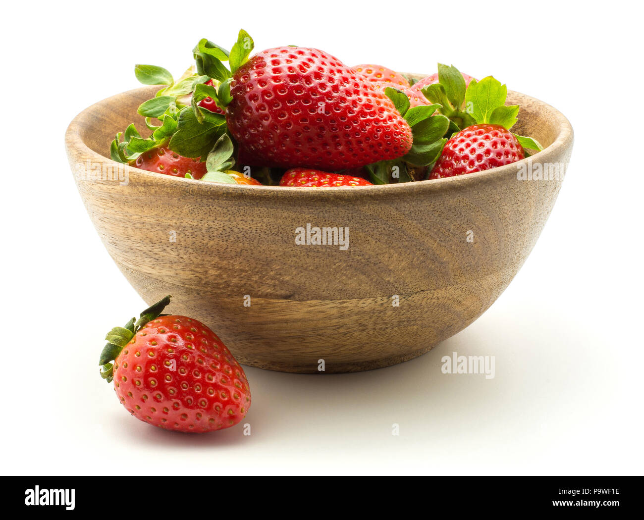 Fresh strawberries in a wooden bowl isolated on white background Stock Photo