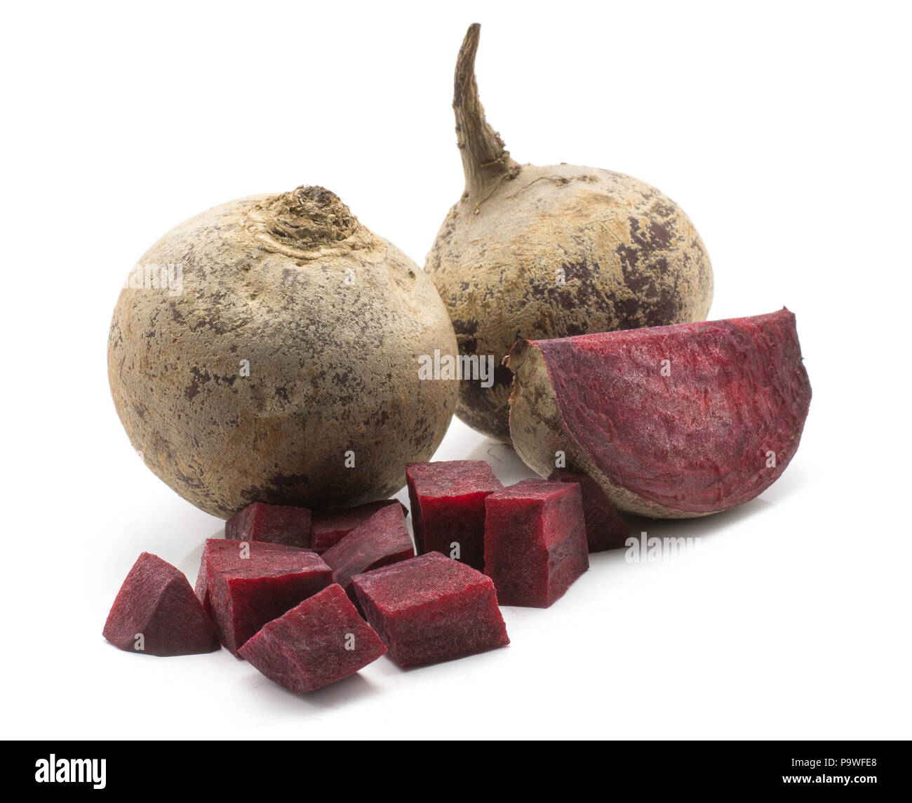Two beetroot bulbs (raw red beet) and two pieces isolated on white background Stock Photo
