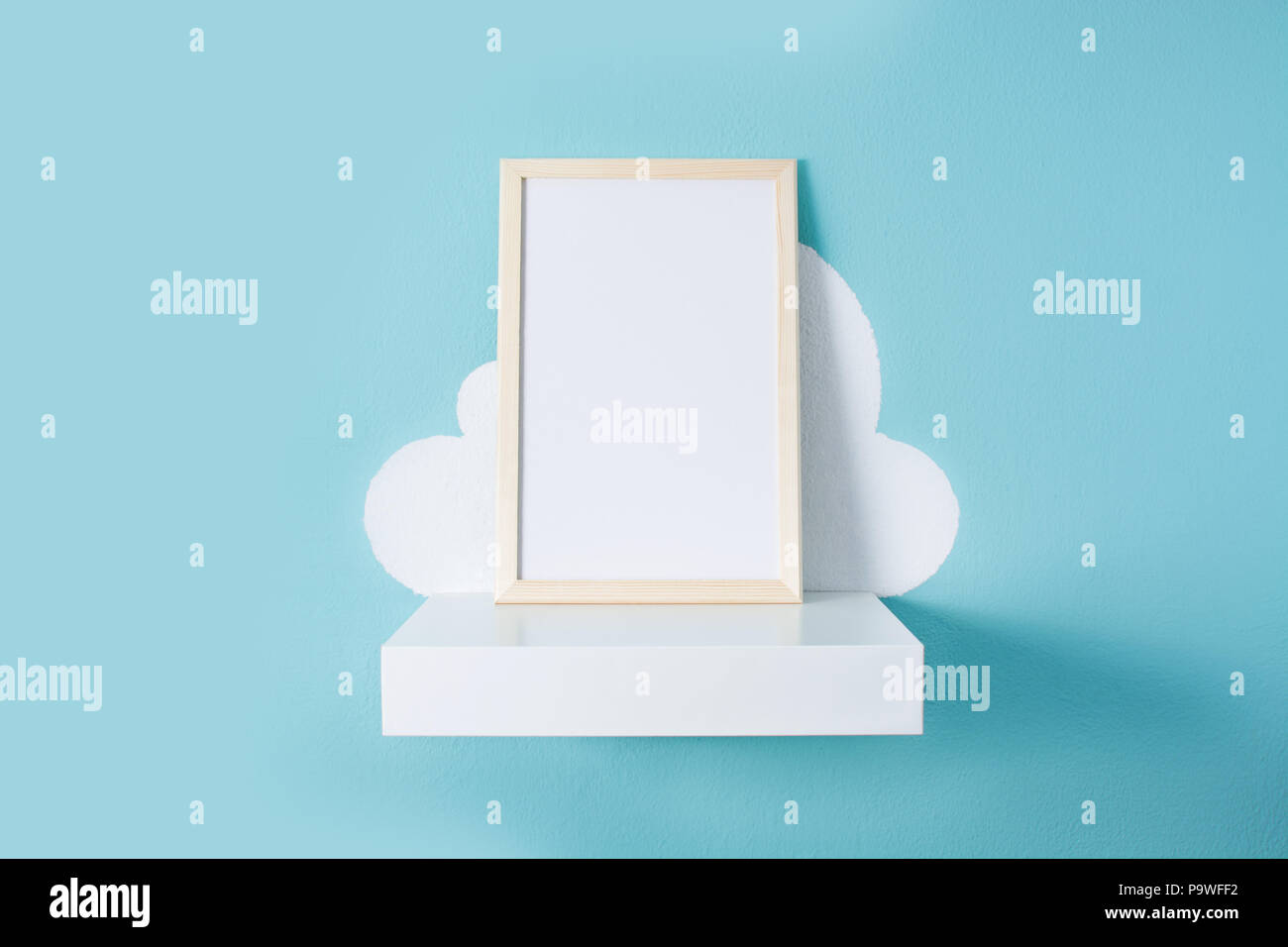 Frame mockup on turquoise wall. Copyspace. Stock Photo
