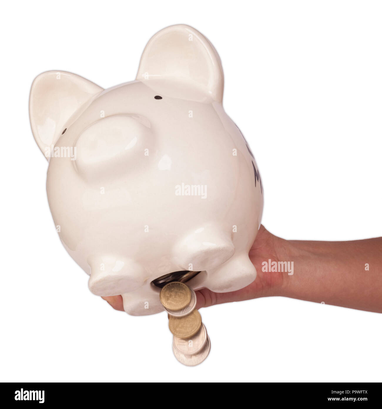 Take off the money from the piggy bank studio shoot Stock Photo