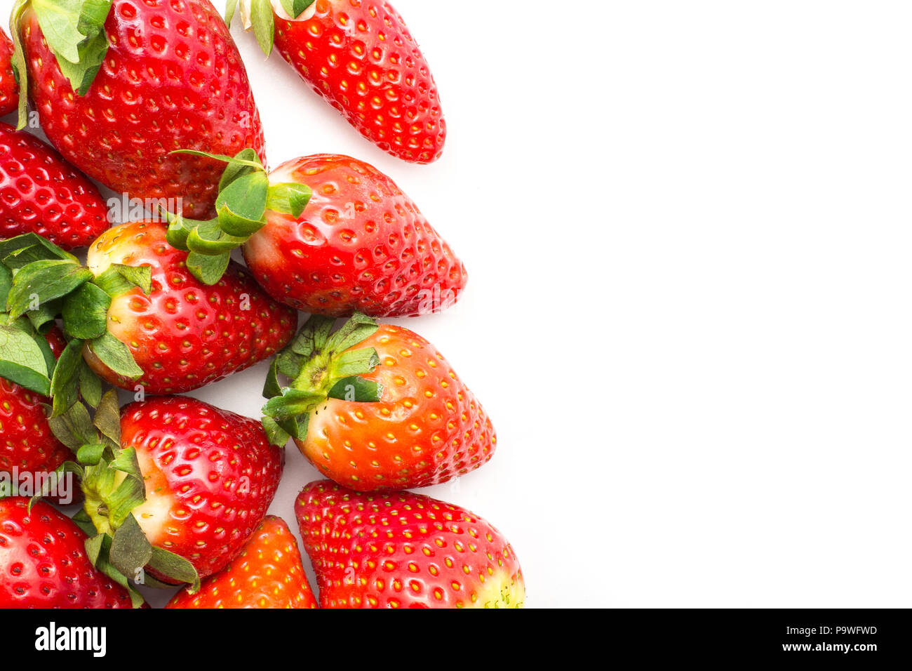 Fresh garden strawberries background isolated on white left side Stock Photo